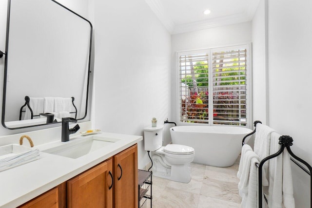 bathroom featuring a bath, toilet, ornamental molding, and vanity