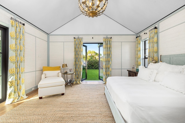 bedroom featuring a notable chandelier, crown molding, access to outside, and lofted ceiling