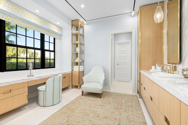 full bath with double vanity, recessed lighting, and a sink