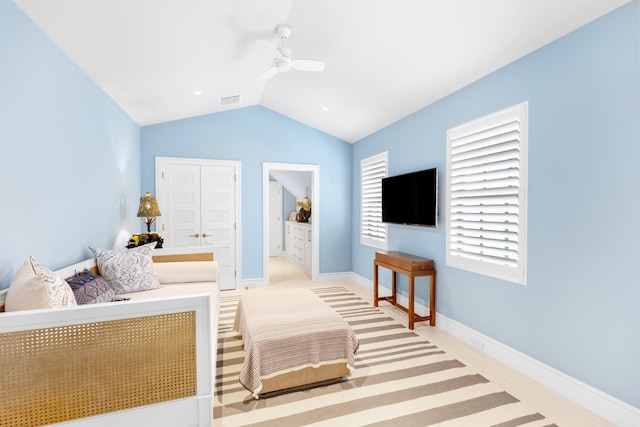 bedroom featuring ceiling fan and vaulted ceiling