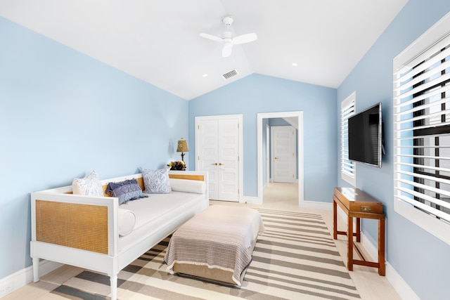 bedroom featuring visible vents, lofted ceiling, multiple windows, and baseboards