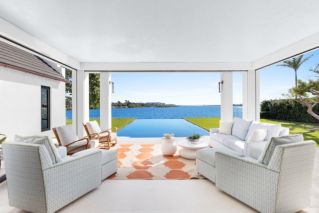 interior space with a water view and outdoor lounge area