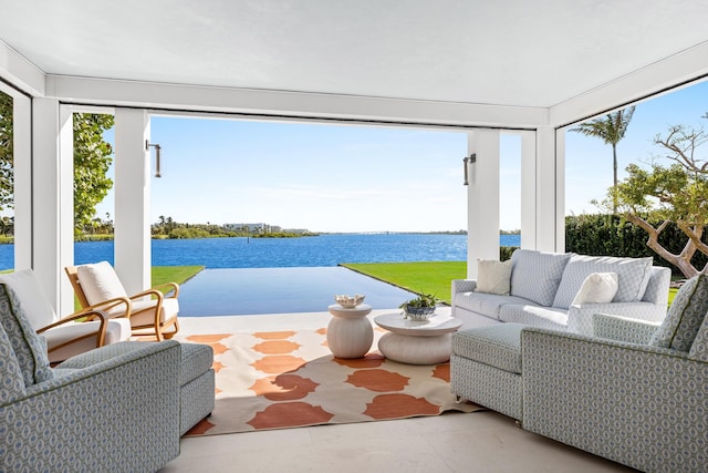 sunroom / solarium with a water view and a wealth of natural light