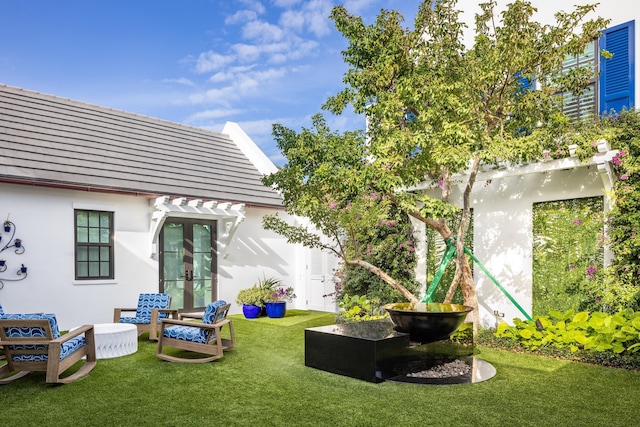 view of yard featuring french doors