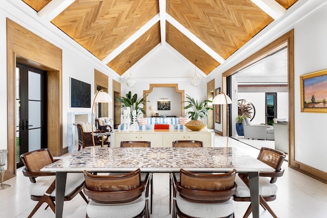 dining room featuring ornamental molding, high vaulted ceiling, a chandelier, and wooden ceiling