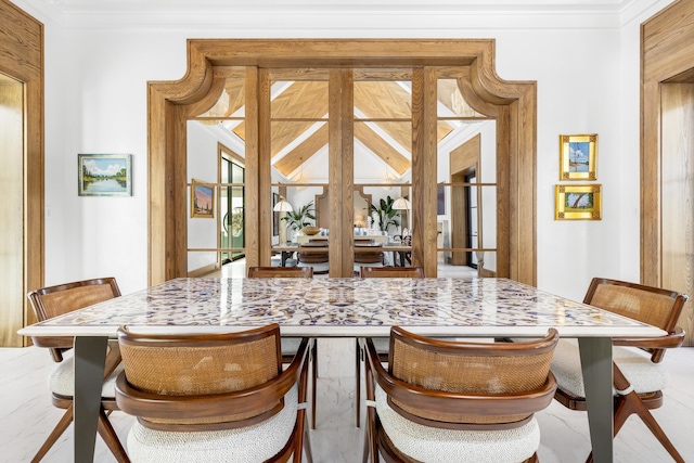 dining area featuring crown molding