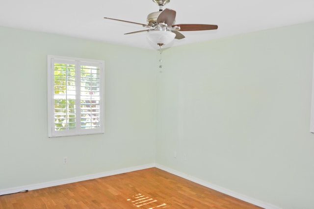 spare room with ceiling fan and hardwood / wood-style floors