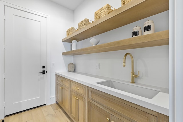 kitchen featuring sink and light hardwood / wood-style floors