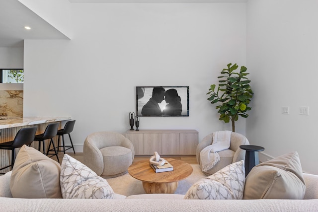 living room with light hardwood / wood-style flooring