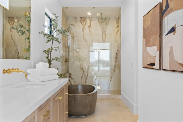 bathroom featuring plenty of natural light, independent shower and bath, and vanity