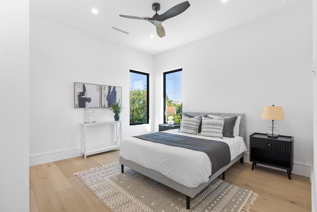 bedroom featuring ceiling fan and hardwood / wood-style floors