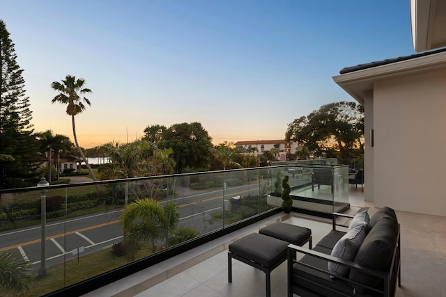 view of balcony at dusk