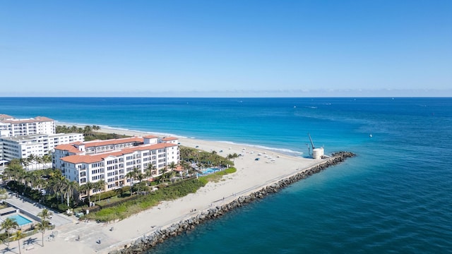 drone / aerial view featuring a view of the beach and a water view