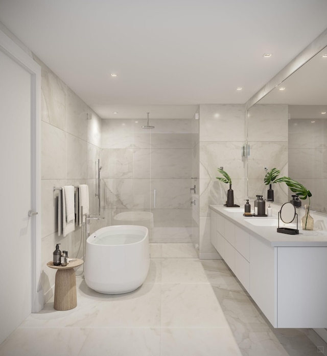 bathroom featuring vanity, tile walls, and shower with separate bathtub