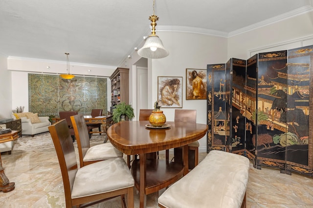 dining room featuring ornamental molding