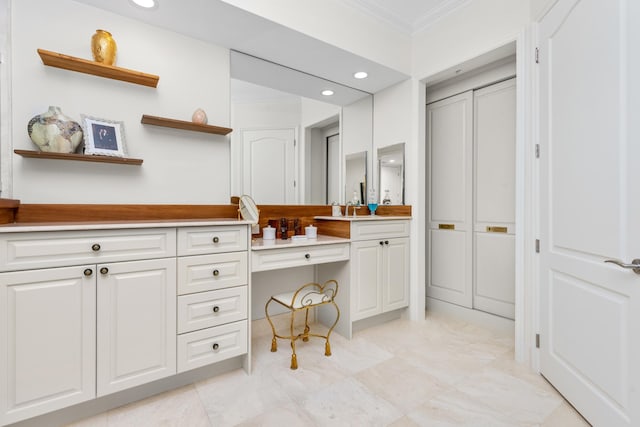 bathroom featuring vanity and crown molding