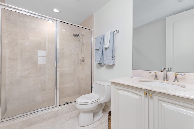 bathroom featuring toilet, tile patterned flooring, walk in shower, and vanity