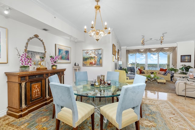 dining area featuring an inviting chandelier and crown molding