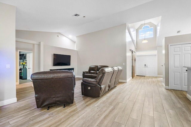 living room with high vaulted ceiling