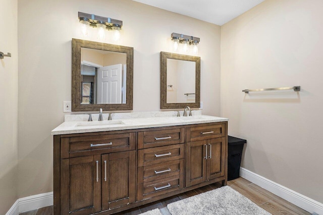 bathroom with vanity and hardwood / wood-style flooring