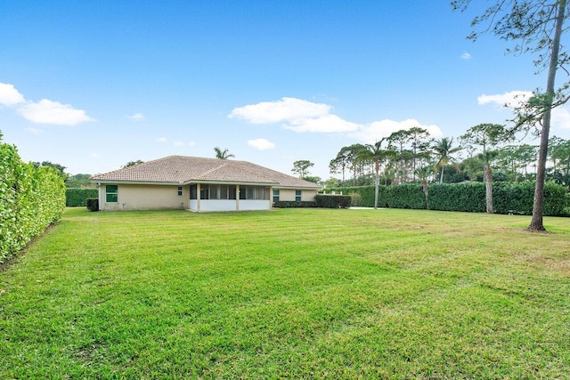 view of yard with a sunroom