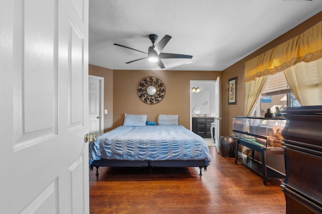 bedroom featuring a textured ceiling, ceiling fan, and wood finished floors