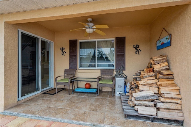 view of patio featuring ceiling fan