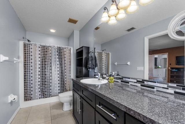 ensuite bathroom featuring toilet, tile patterned flooring, visible vents, and ensuite bathroom