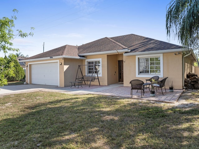 ranch-style home featuring a garage, a shingled roof, a front lawn, and stucco siding