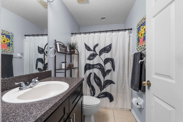 bathroom featuring a textured ceiling, tile patterned flooring, toilet, a shower with shower curtain, and vanity