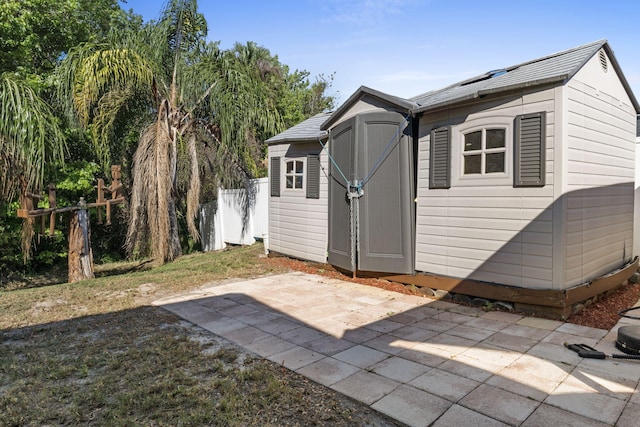 view of shed with fence