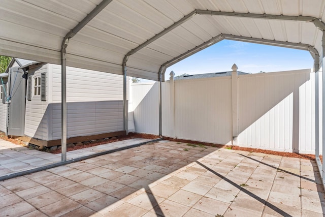 view of patio / terrace featuring a carport and fence