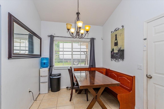 tiled dining area with an inviting chandelier