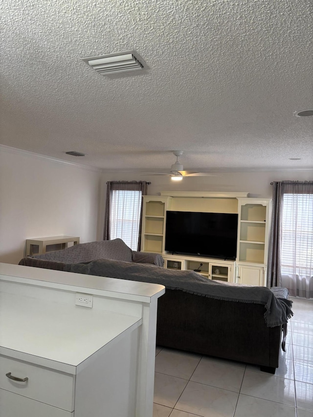 tiled living room with a textured ceiling