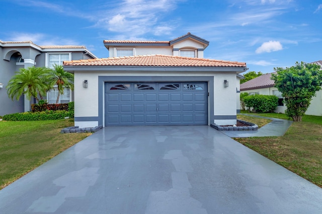 mediterranean / spanish-style home featuring a front yard and a garage