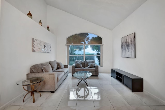 living room featuring light tile patterned flooring and lofted ceiling