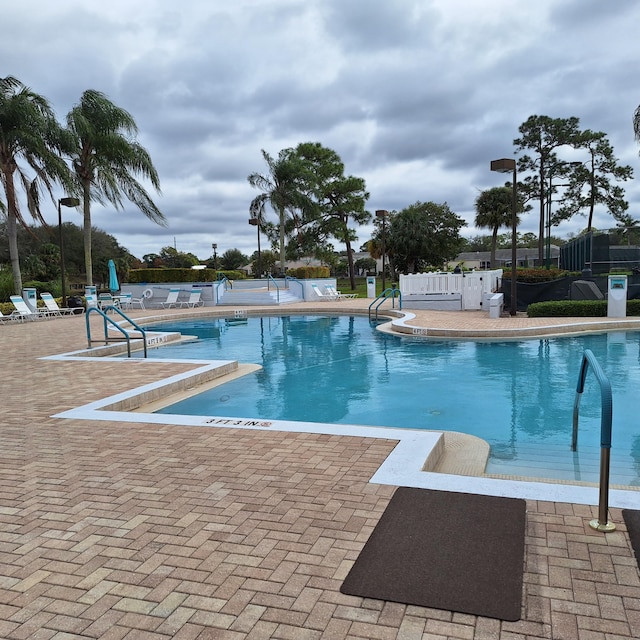 view of swimming pool featuring a patio