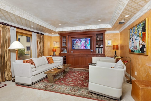 living room featuring a tray ceiling and crown molding