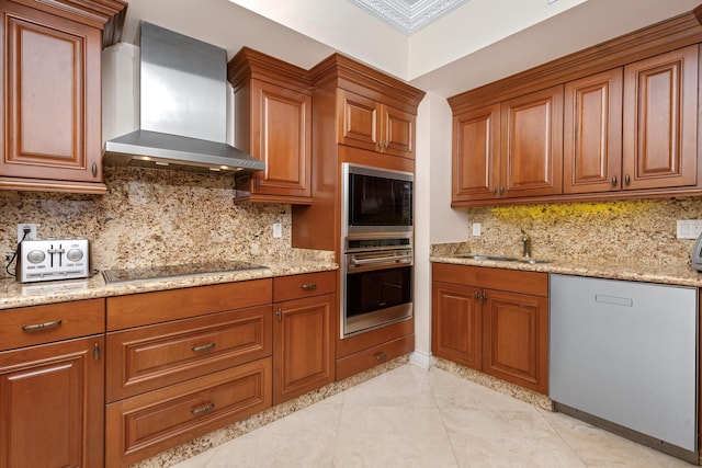 kitchen with light stone counters, dishwasher, black electric stovetop, and wall chimney range hood