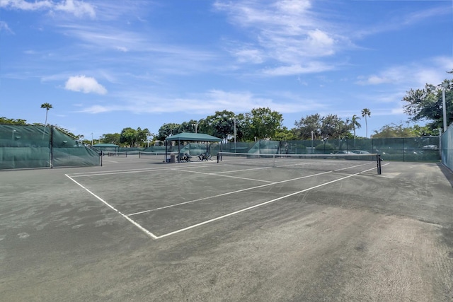 view of sport court with fence