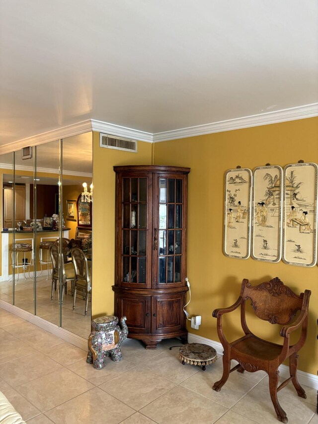 doorway to outside with crown molding, french doors, and light tile patterned flooring