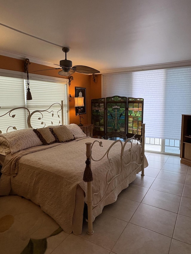 bedroom featuring ceiling fan and tile patterned floors