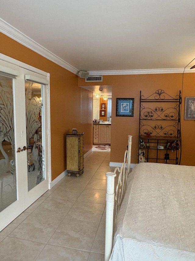 bedroom with french doors, visible vents, crown molding, and light tile patterned floors