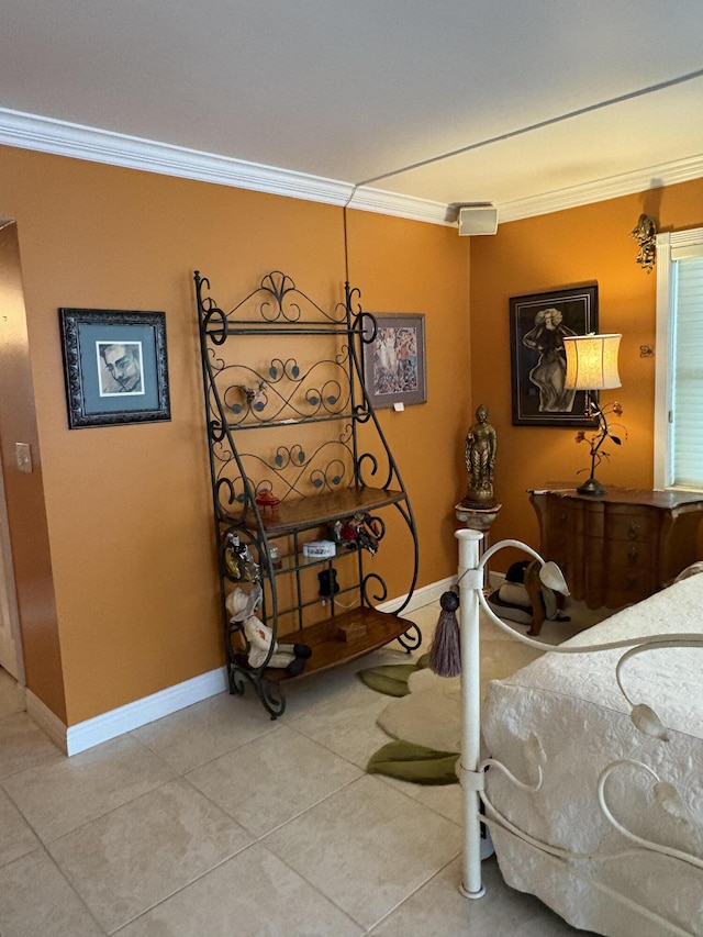 bedroom with light tile patterned floors, ornamental molding, and baseboards