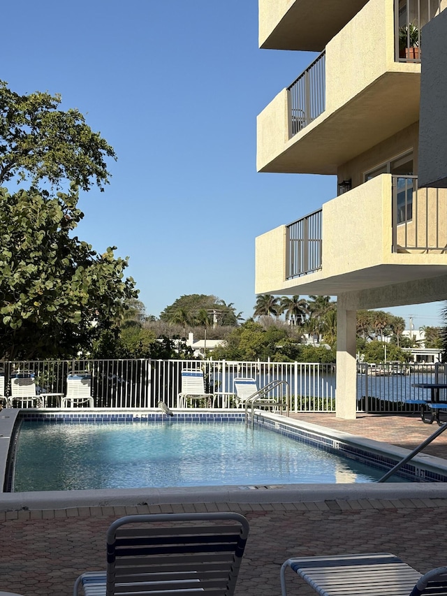 community pool featuring fence