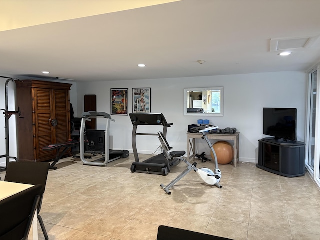 exercise room featuring baseboards, light tile patterned floors, visible vents, and recessed lighting