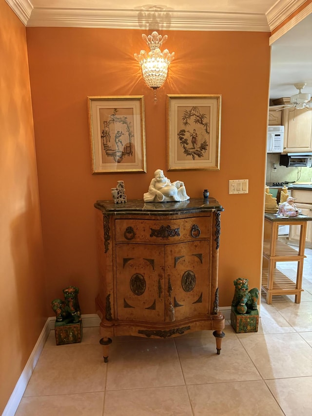 room details with ornamental molding and an inviting chandelier