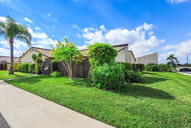 view of home's exterior with a yard