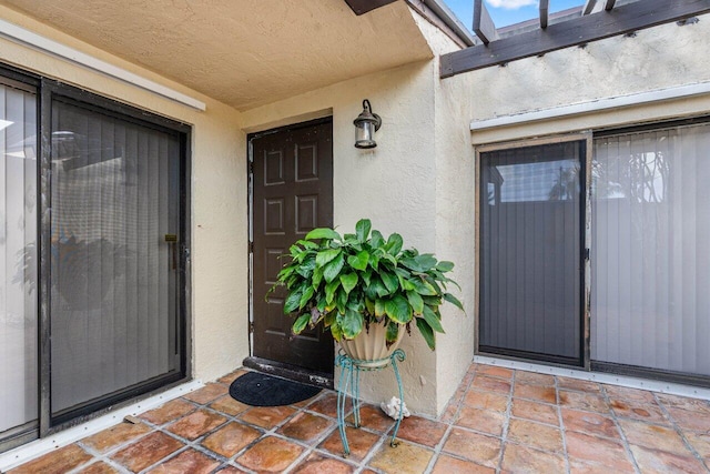 property entrance with a patio