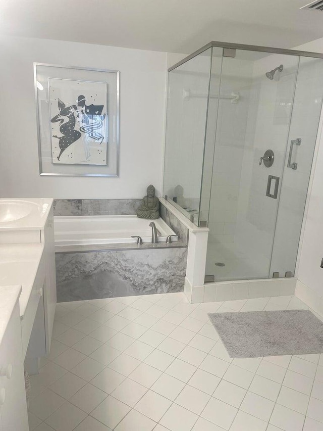 bathroom featuring separate shower and tub, tile patterned floors, and vanity